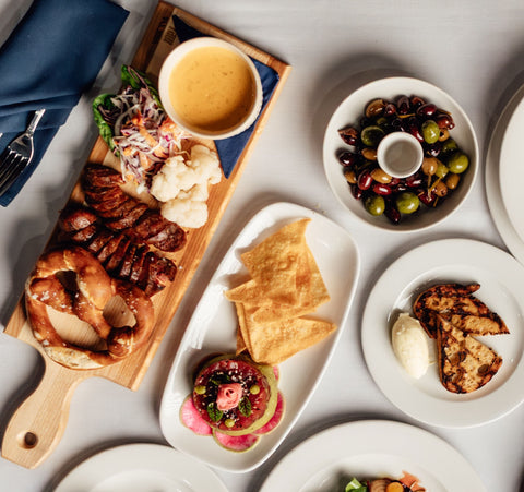 Charcuterie board, olives, and seasonal small plates served at House of McGrath in downtown Toronto.