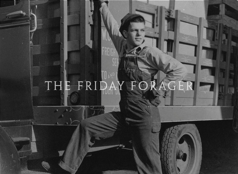 Person in overalls standing next to a truck with 'The Friday Forager' text.