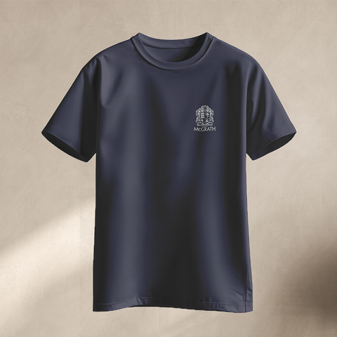 Front view of navy short sleeve shirt with McGrath crest logo on chest